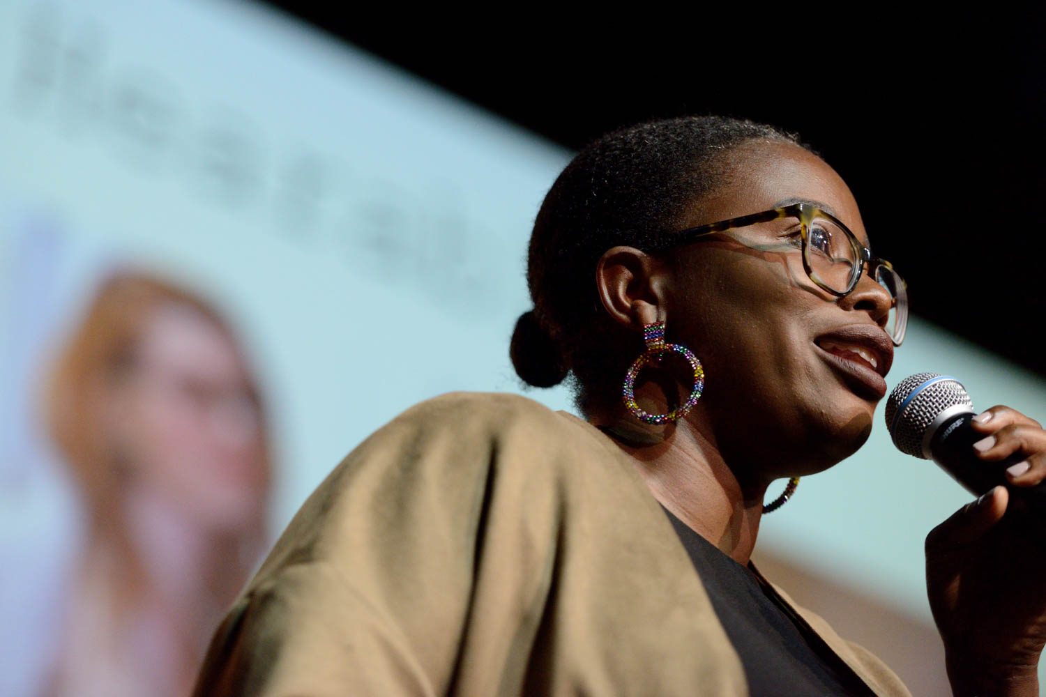 Muchaneta Kapfunde (FASHNERD) speaking about HEARABLES (and wearing on) at the Wear It Festival - The Conference on Wearables, fashion tech, smart clothing and consumer innovation on 19-20 June 2018 at the Kulturbrauerei Berlin - (c) Wear It Berlin / Michael Wittig, Berlin